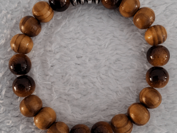 Bracelet en bois foncé travaillé Bracelet en Bois Foncé – Perles Artisanales du Niger